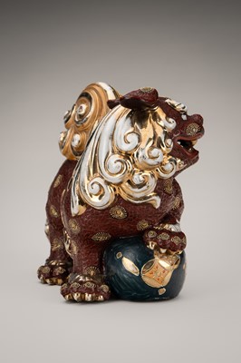 Lot 205 - AN IMARI PORCELAIN FIGURE OF A SHISHI WITH BALL