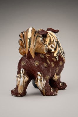 Lot 205 - AN IMARI PORCELAIN FIGURE OF A SHISHI WITH BALL