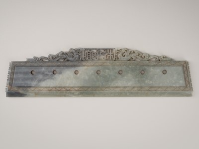 Lot 832 - AN ARCHAISTIC RITUAL CELADON JADE BLADE WITH OPENWORK DRAGONS