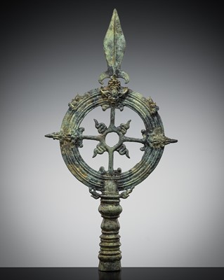 Lot 465 - A BRONZE ‘WHEEL OF LAW AND SPEAR HEAD’ FINIAL, EAST JAVA, 13TH-14TH CENTURY