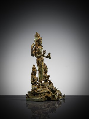 Lot 462 - A RARE BRONZE TRIAD OF SHIVA AND HIS CONSORTS PARVATI AND SATI WITH NANDI, CENTRAL JAVA, 11TH CENTURY