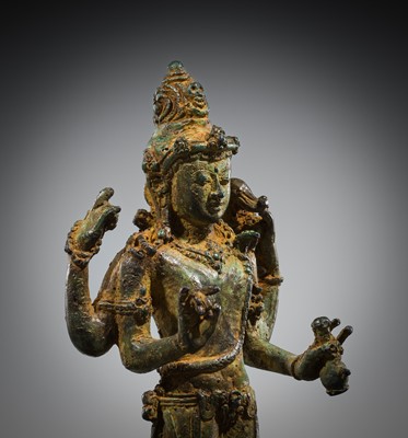 Lot 462 - A RARE BRONZE TRIAD OF SHIVA AND HIS CONSORTS PARVATI AND SATI WITH NANDI, CENTRAL JAVA, 11TH CENTURY
