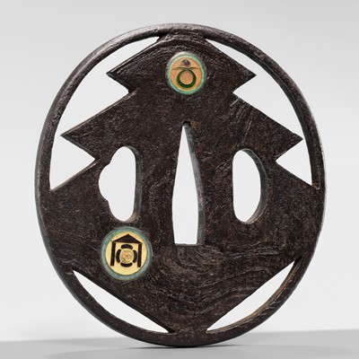 Lot 55 - UEDA MASAYOSHI: A RARE SHIPPO-INLAID IRON SUKASHI TSUBA WITH THE SANGAIBISHI MON
