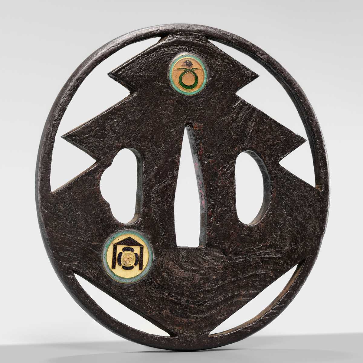 Lot 55 - UEDA MASAYOSHI: A RARE SHIPPO-INLAID IRON SUKASHI TSUBA WITH THE SANGAIBISHI MON
