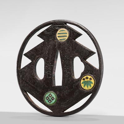 Lot 55 - UEDA MASAYOSHI: A RARE SHIPPO-INLAID IRON SUKASHI TSUBA WITH THE SANGAIBISHI MON