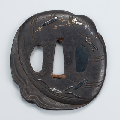 Lot 1522 - A CONCH-SHAPED IRON TSUBA WITH SEALIFE MOTIFS