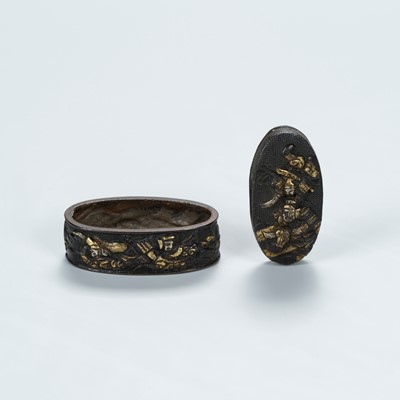 Lot 1640 - A SHAKUDO FUCHI AND KASHIRA WITH A SAMURAI BATTLE SCENE