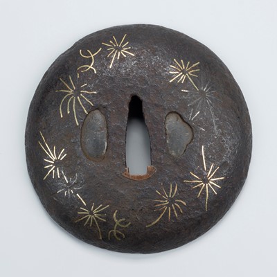 Lot 1534 - A HIZEN IRON TSUBA WITH STYLIZED PAMPAS GRASS AND DANDELION DESIGN, WITH NBTHK HOZON TOKEN CERTIFICATE