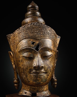 Lot 433 - A LARGE GILT-BRONZE HEAD OF BUDDHA, AYUTTHAYA KINGDOM, 17TH CENTURY