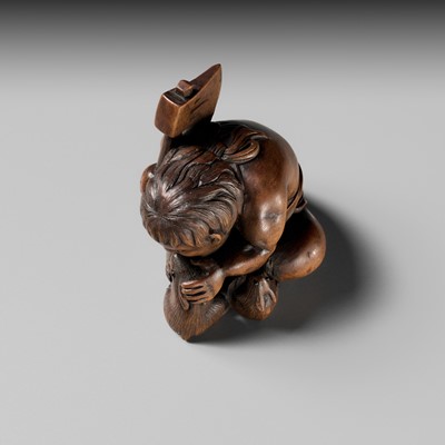 Lot 173 - A WOOD NETSUKE OF KINTARO WITH TWO RABBITS, CIRCLE OF TAMETAKA