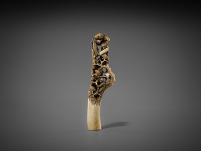 Lot 530 - AN AMUSING ANTLER CANE HANDLE OF MONKEYS AND BIRDS ON A PINE TREE