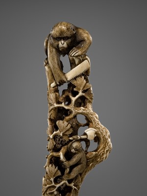 Lot 530 - AN AMUSING ANTLER CANE HANDLE OF MONKEYS AND BIRDS ON A PINE TREE