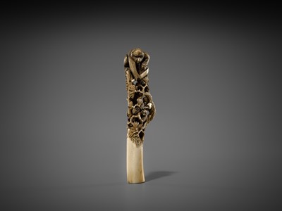 Lot 530 - AN AMUSING ANTLER CANE HANDLE OF MONKEYS AND BIRDS ON A PINE TREE