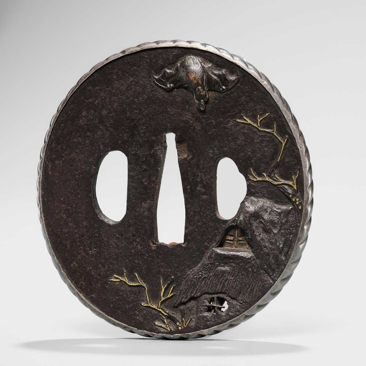 Lot 1649 - AN IRON SHOAMI SCHOOL TSUBA WITH A BAT AND