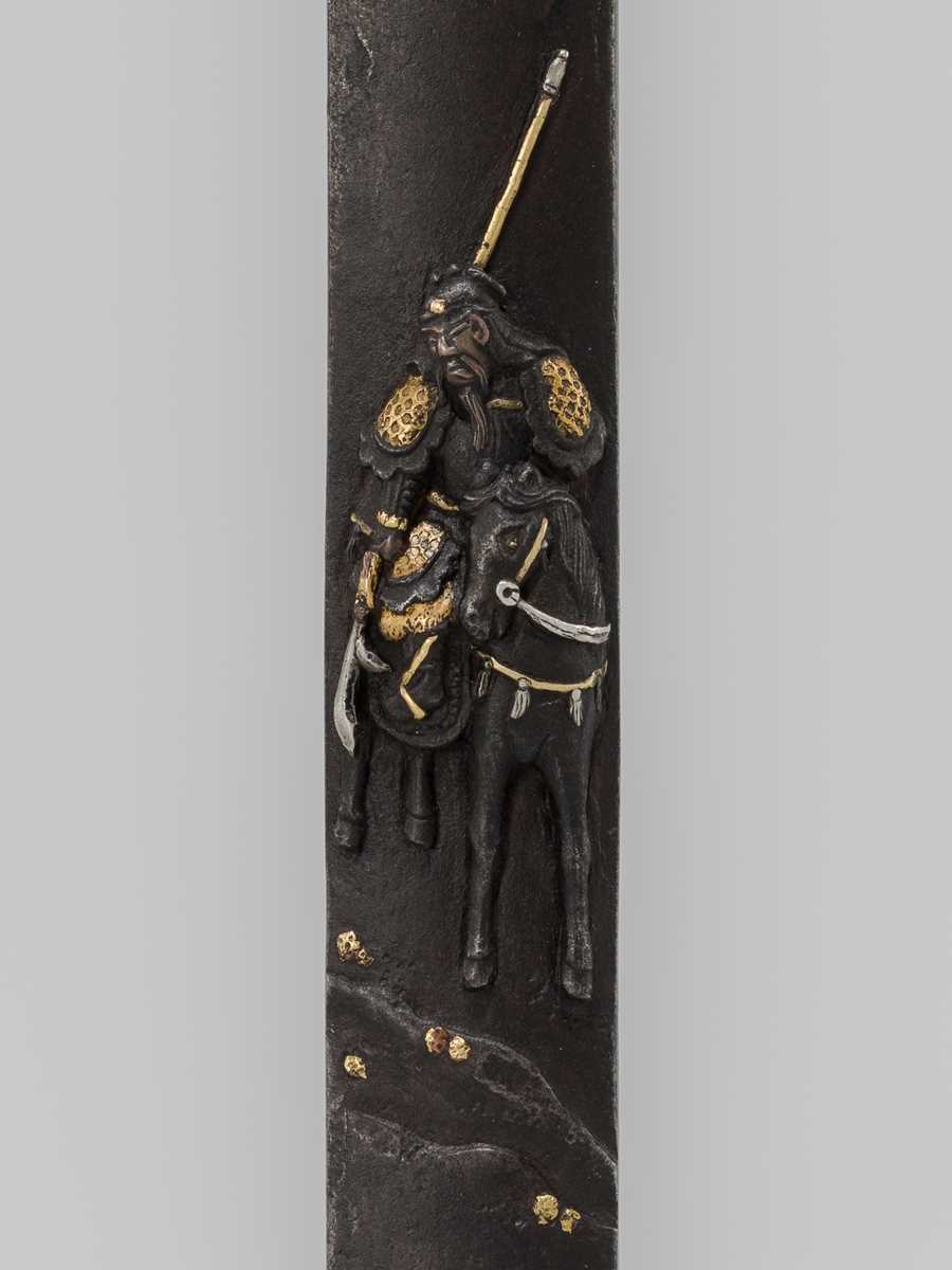 Lot 1929 - MINAMOTO SHIGEHIRO: AN AIZU SHOAMI SCHOOL IRON KOZUKA WITH THE CHINESE GENERAL KAN'U AND HIS STEED