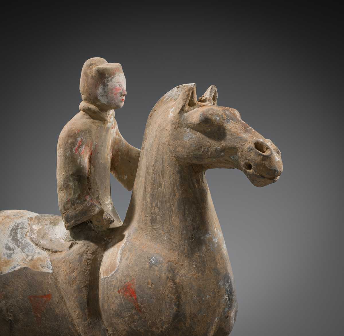 A PAINTED POTTERY HORSE AND RIDER, HAN DYNASTY