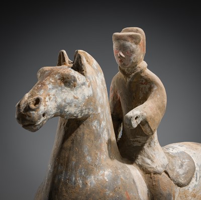 A PAINTED POTTERY HORSE AND RIDER, HAN DYNASTY