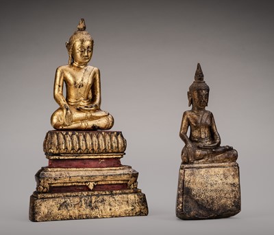 Lot 1049 - A LOT WITH TWO GILT-LACQUERED FIGURES OF BUDDHA SHAKYAMUNI