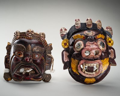 Lot 1693 - A GROUP OF TWO PAINTED WOOD ‘MAHAKALA’ MASKS