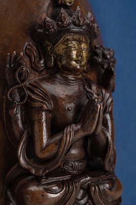 Lot 820 - A GILT AND COPPER-REPOUSSÉ LEAF WITH SHADAKSHARI LOKESHVARA, TIBETAN-CHINESE, 17TH CENTURY