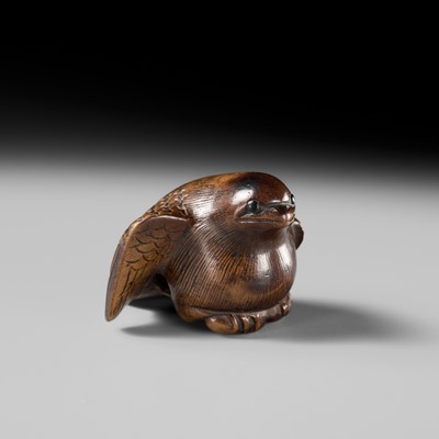 Lot 142 - YOSHINOBU: A RARE WOOD NETSUKE OF A BROODING SPARROW
