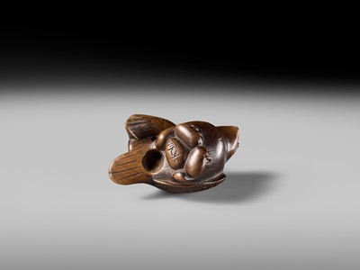 Lot 142 - YOSHINOBU: A RARE WOOD NETSUKE OF A BROODING SPARROW