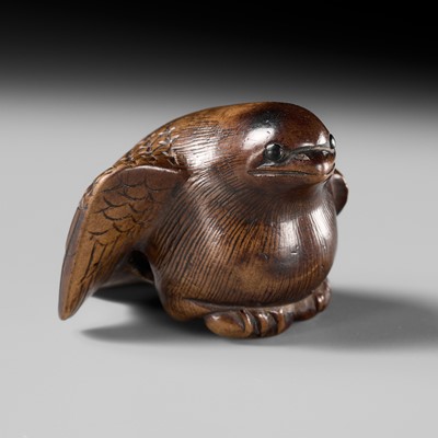 Lot 142 - YOSHINOBU: A RARE WOOD NETSUKE OF A BROODING SPARROW