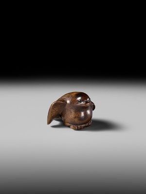 Lot 142 - YOSHINOBU: A RARE WOOD NETSUKE OF A BROODING SPARROW