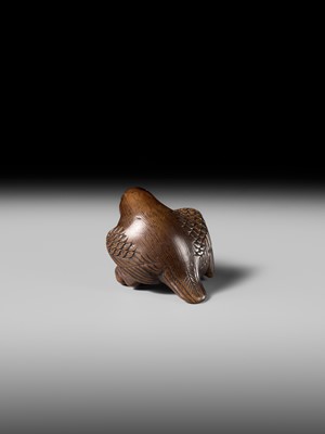 Lot 142 - YOSHINOBU: A RARE WOOD NETSUKE OF A BROODING SPARROW