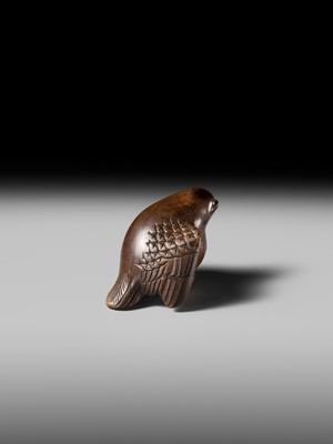 Lot 142 - YOSHINOBU: A RARE WOOD NETSUKE OF A BROODING SPARROW