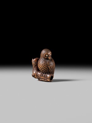 Lot 180 - A FINE NAGOYA SCHOOL WOOD NETSUKE OF AN OWL WITH MOVABLE OWLET