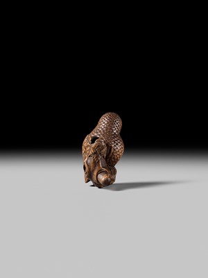 Lot 180 - A FINE NAGOYA SCHOOL WOOD NETSUKE OF AN OWL WITH MOVABLE OWLET
