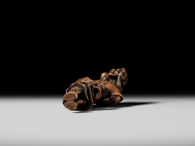 Lot 94 - A TALL WOOD NETSUKE OF A DUTCHMAN WITH CHILD