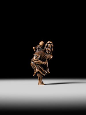 Lot 94 - A TALL WOOD NETSUKE OF A DUTCHMAN WITH CHILD