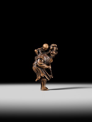 Lot 94 - A TALL WOOD NETSUKE OF A DUTCHMAN WITH CHILD