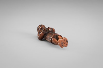 HARAMASA: A WOOD NETSUKE OF A FOREIGNER