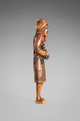 HARAMASA: A WOOD NETSUKE OF A FOREIGNER