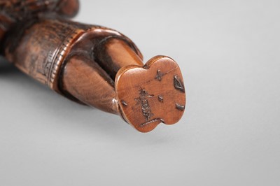 HARAMASA: A WOOD NETSUKE OF A FOREIGNER