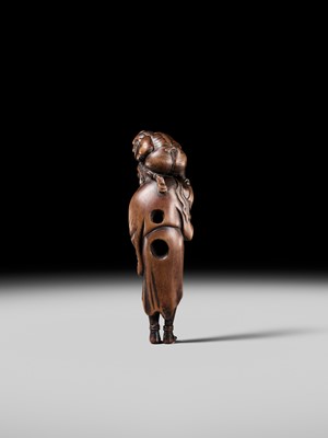 Lot 100 - A RARE WOOD NETSUKE OF A CHINESE IMMORTAL WITH AN ONI