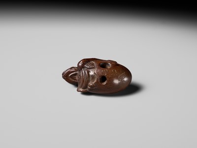 MINKO: A RARE AND UNUSUAL WOOD NETSUKE OF A HATCHING TENGU (TENGU NO TOMAGO)