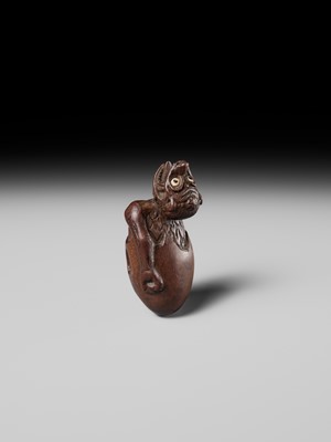 MINKO: A RARE AND UNUSUAL WOOD NETSUKE OF A HATCHING TENGU (TENGU NO TOMAGO)