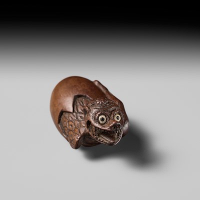 MINKO: A RARE AND UNUSUAL WOOD NETSUKE OF A HATCHING TENGU (TENGU NO TOMAGO)
