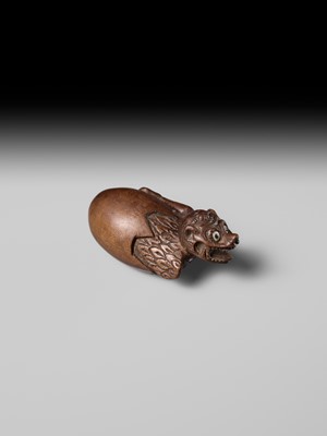MINKO: A RARE AND UNUSUAL WOOD NETSUKE OF A HATCHING TENGU (TENGU NO TOMAGO)