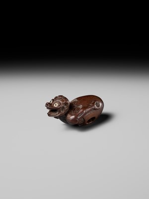 MINKO: A RARE AND UNUSUAL WOOD NETSUKE OF A HATCHING TENGU (TENGU NO TOMAGO)