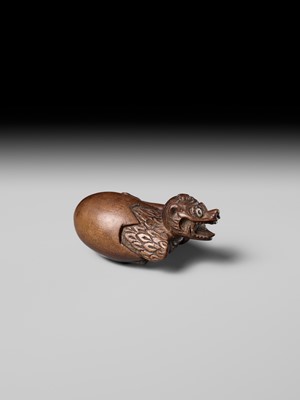 MINKO: A RARE AND UNUSUAL WOOD NETSUKE OF A HATCHING TENGU (TENGU NO TOMAGO)