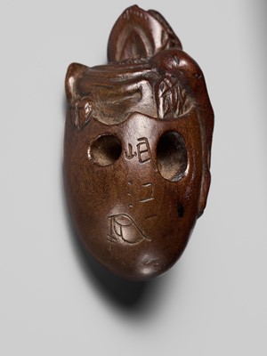 MINKO: A RARE AND UNUSUAL WOOD NETSUKE OF A HATCHING TENGU (TENGU NO TOMAGO)