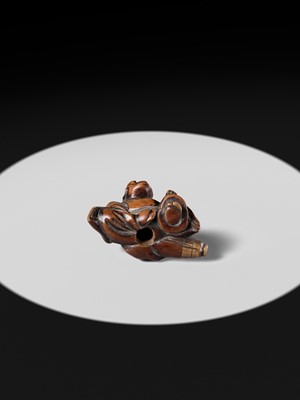 A WOOD NETSUKE OF A TEMPLE SERVANT (EJI)