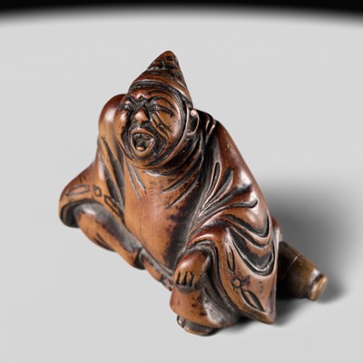A WOOD NETSUKE OF A TEMPLE SERVANT (EJI)