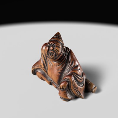 A WOOD NETSUKE OF A TEMPLE SERVANT (EJI)