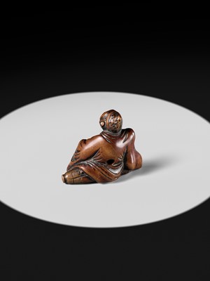 A WOOD NETSUKE OF A TEMPLE SERVANT (EJI)